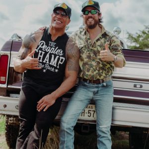Chris Janson & Dwayne "The Rock" Johnson in front of a truck